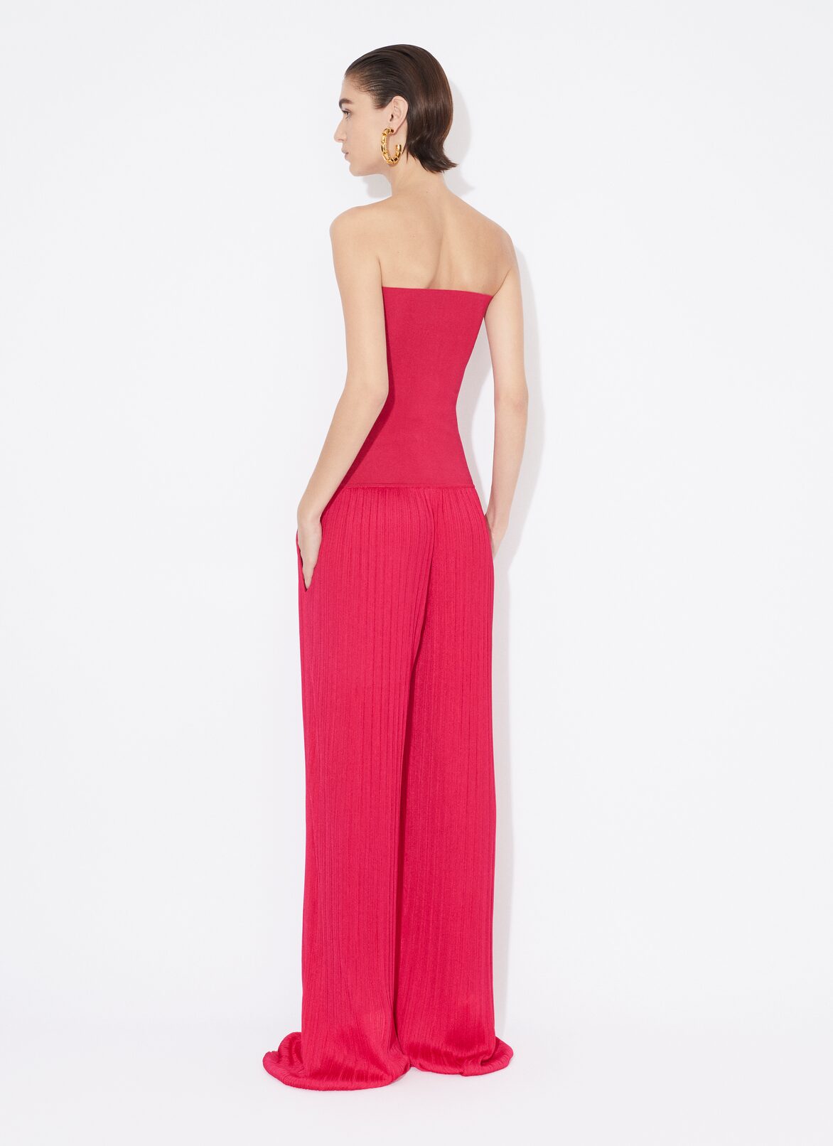 BUSTIER JUMPSUIT IN PLEATED KNIT ALAÏA PINK BUSTIER JUMPSUIT IN PLEATED KNIT